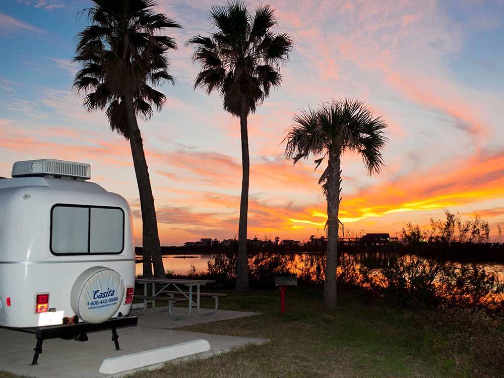 RV parked with a nice sunset view at DELLANERA RV PARK