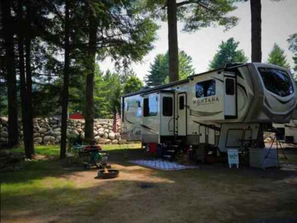 RV site in the trees at Lost Acres RV Park