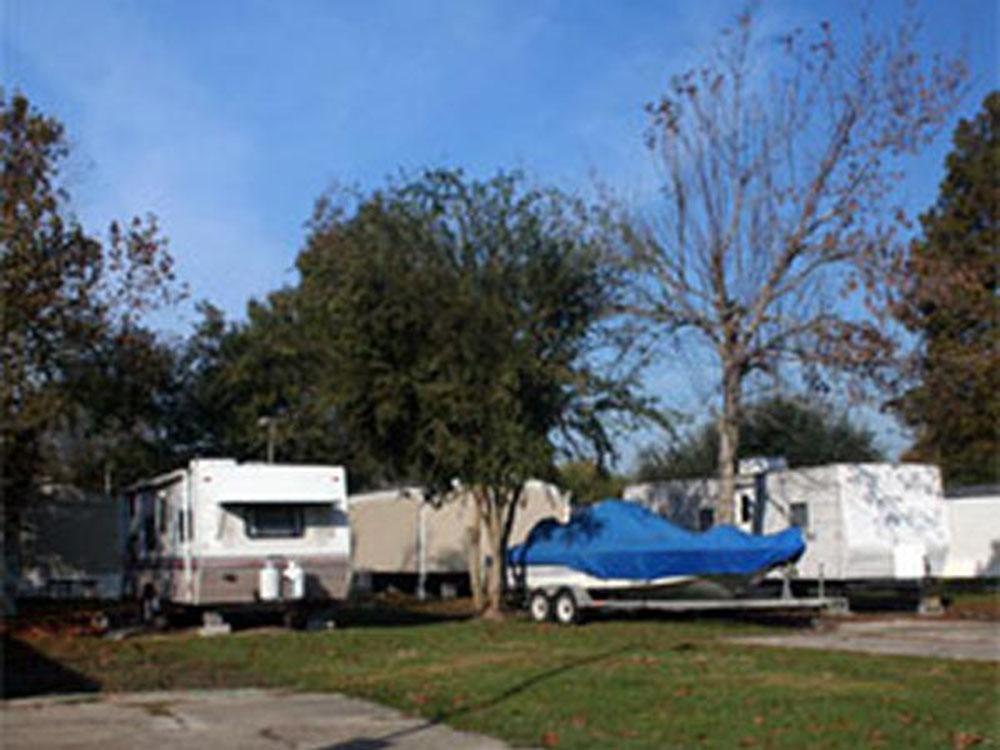 RV at site with boat parking at SWEET GUM MOBILE HOME AND RV COMMUNITY