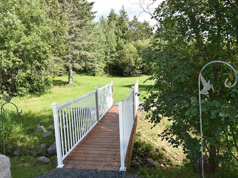 A wooden walking bridge at THE WILLOWS RV PARK & CAMPGROUND