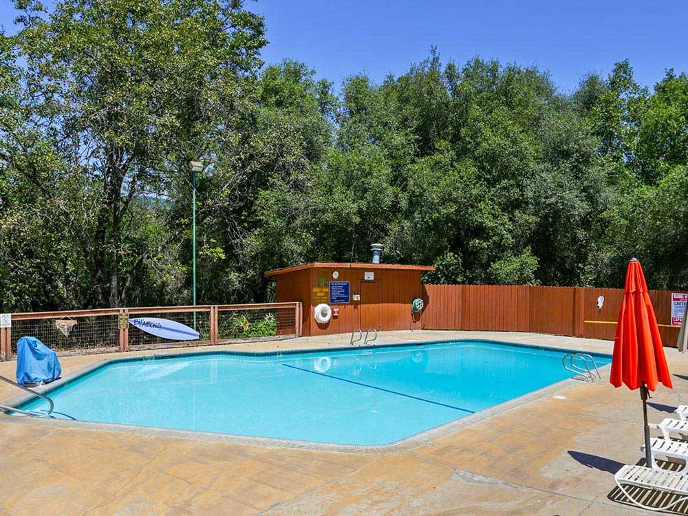 Swimming pool with outdoor seating at THOUSAND TRAILS LAKE OF THE SPRINGS