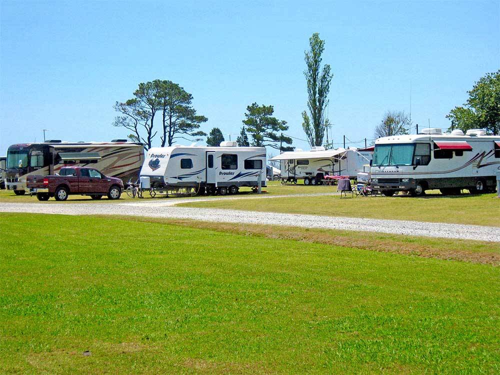RVs parked on grassy sites at THOUSAND TRAILS VIRGINIA LANDING