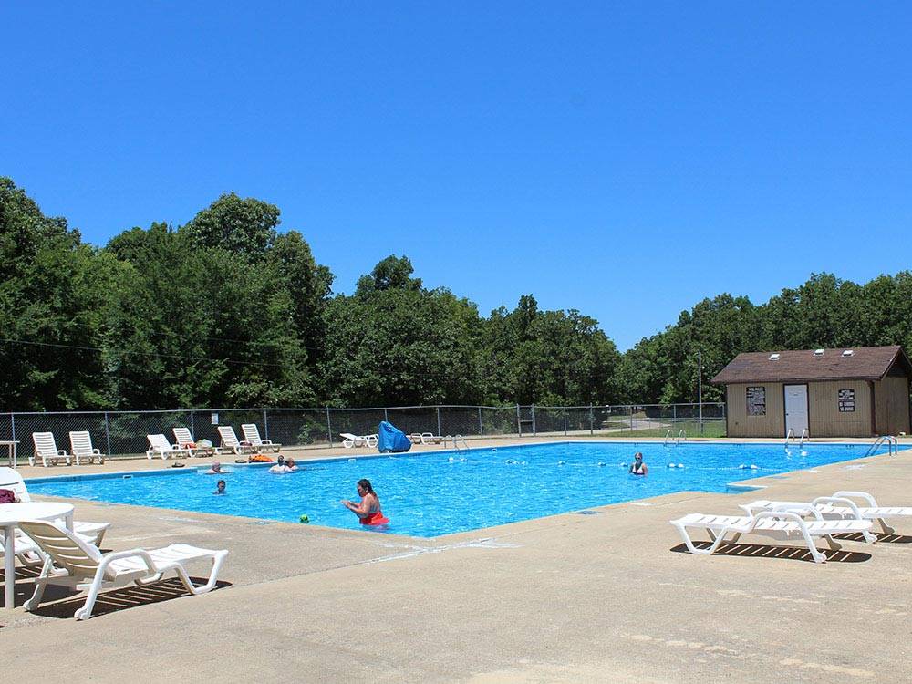 Swimming pool with outdoor seating at THOUSAND TRAILS CHEROKEE LANDING