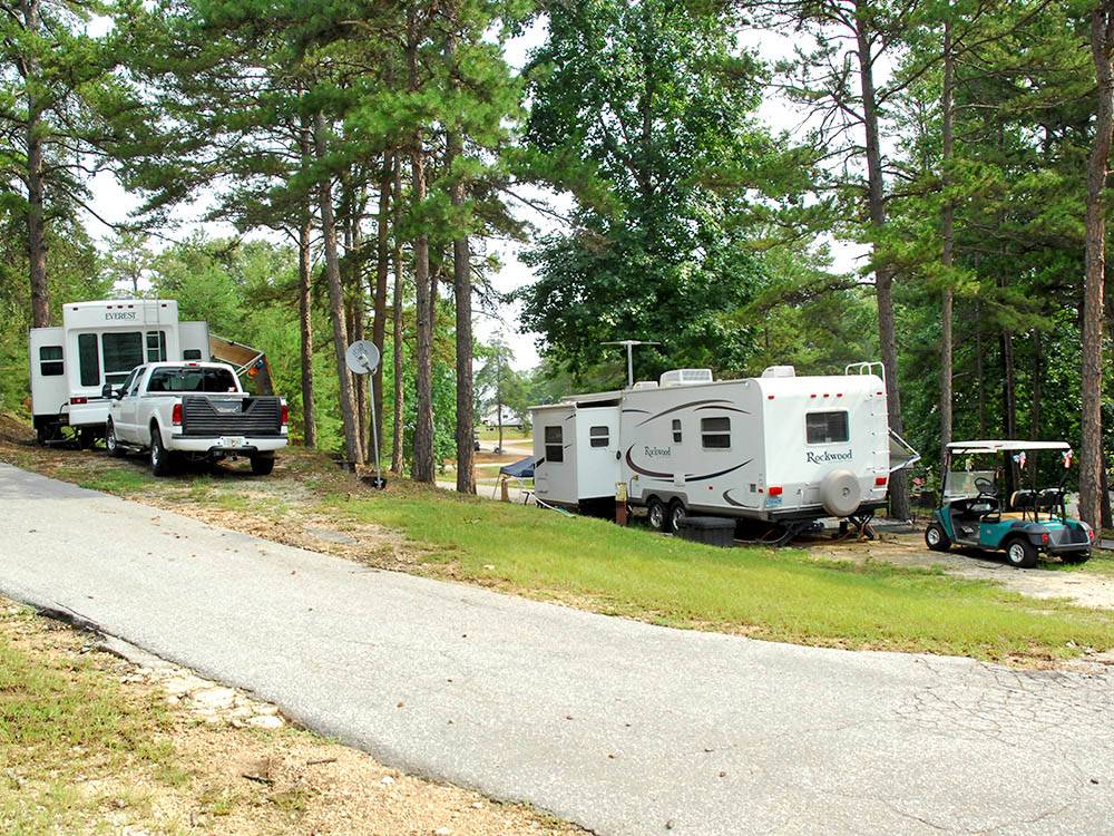 Trailers camping at campsite at THOUSAND TRAILS CAROLINA LANDING