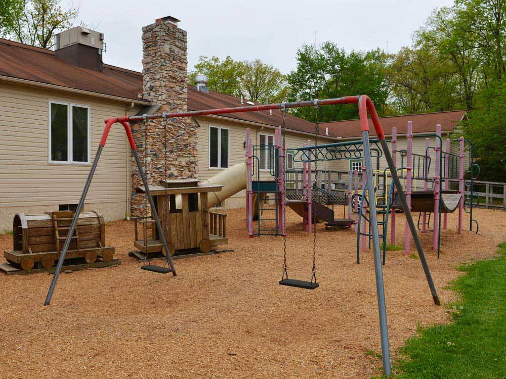 Playground with swing set at APPALACHIAN CAMPING RESORT