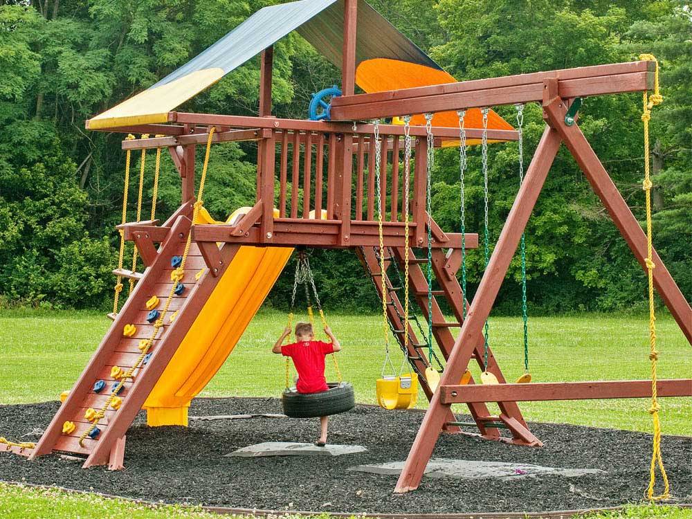 Playground with swing set at THOUSAND TRAILS WILMINGTON