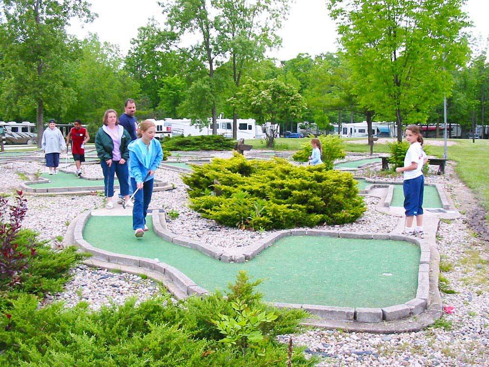 Campers playing miniature golf at THOUSAND TRAILS ST CLAIR