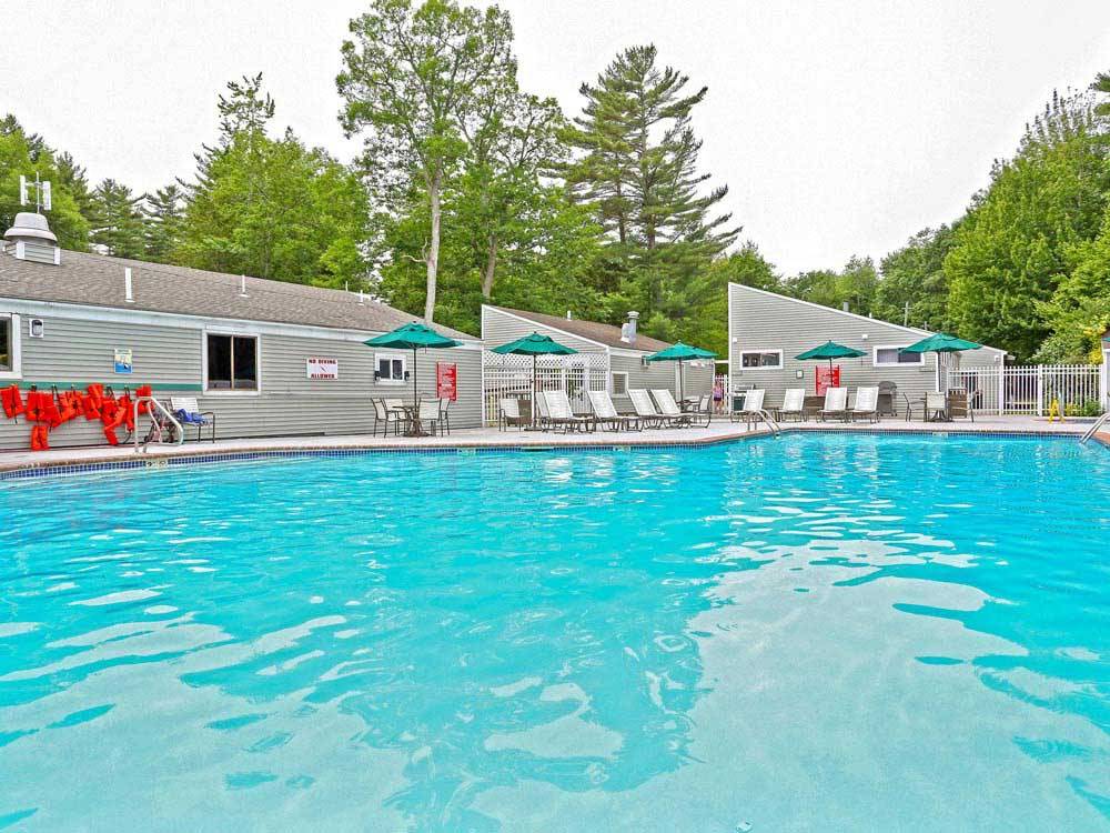 Swimming pool with outdoor seating at THOUSAND TRAILS MOODY BEACH