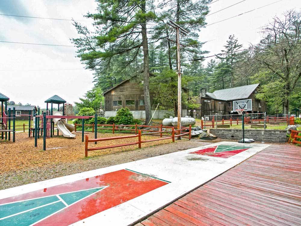 Playground with shuffleboard and basketball  at THOUSAND TRAILS STURBRIDGE