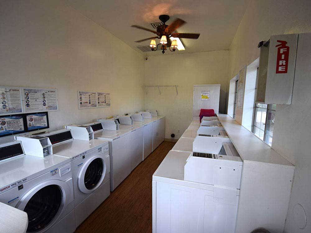 Laundry room with washers and dryers at DUCK CREEK RV PARK