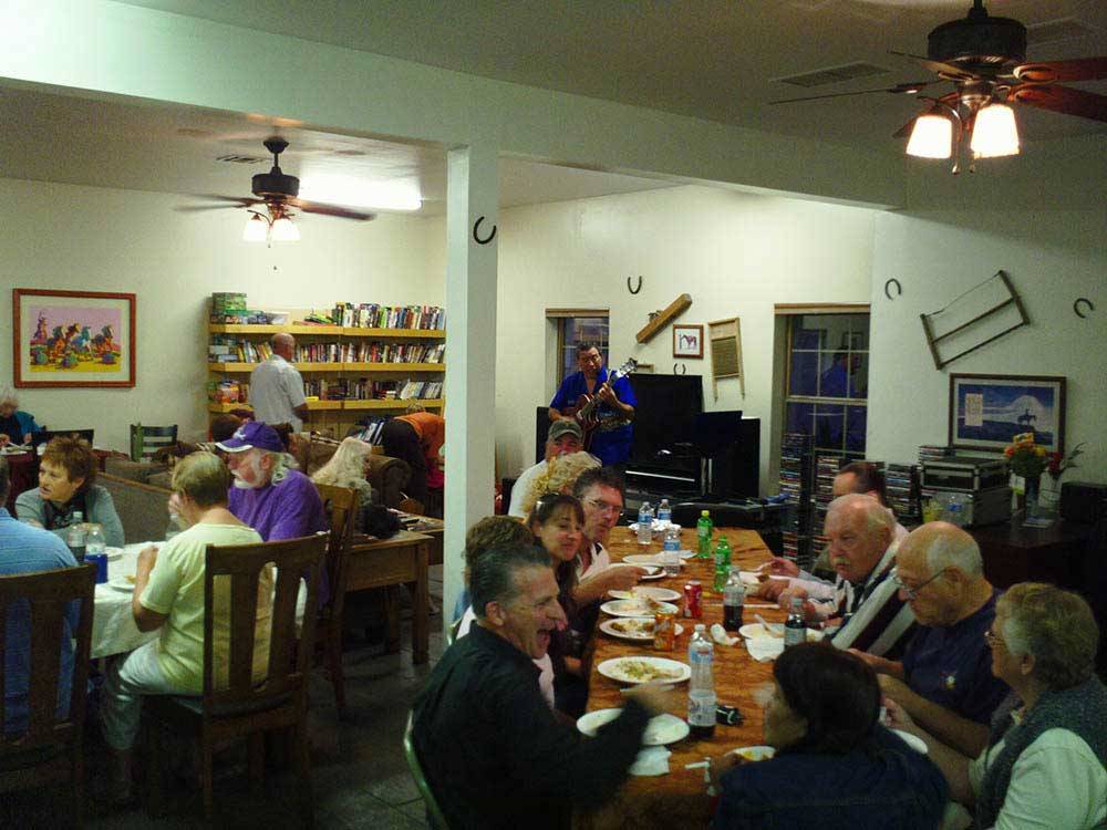 Guests dining with live music at DUCK CREEK RV PARK