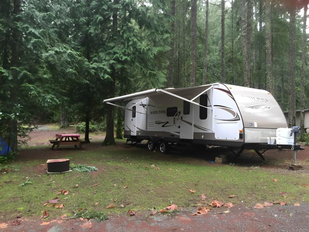 Trailer parked at site Mountainaire Campground & RV Park