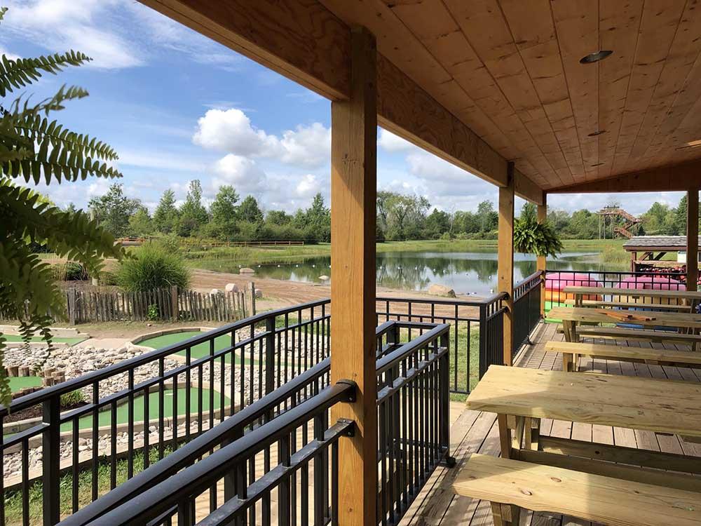 Patio area with picnic tables overlooking lake at HTR NIAGARA
