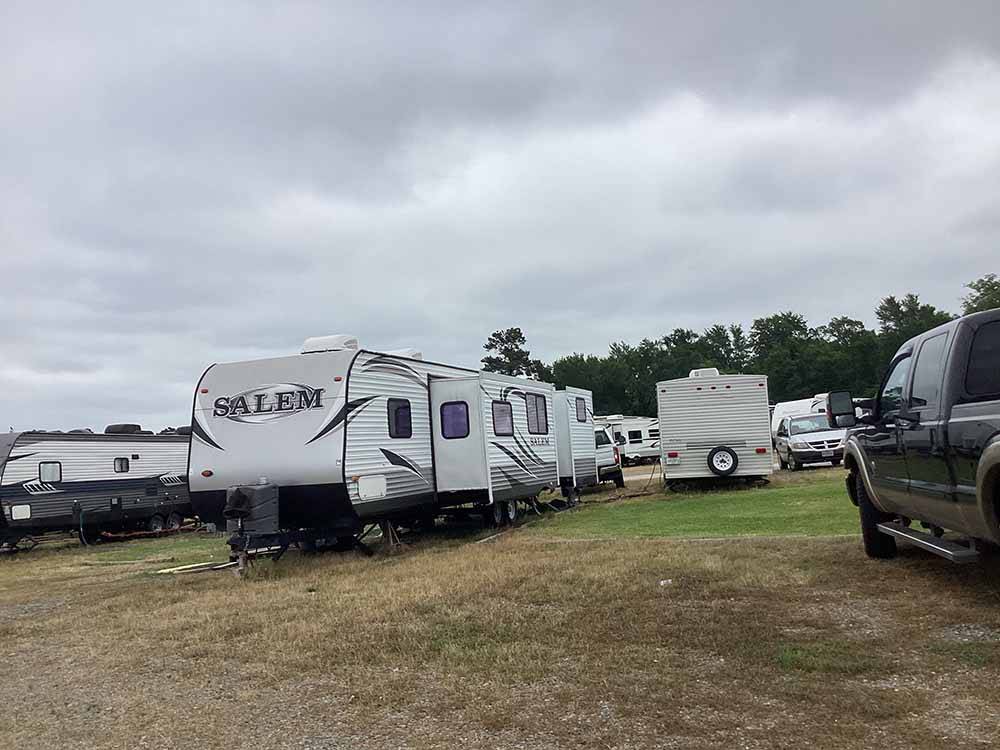 A group of grassy RV sites at SOUTHERN LIVING RV PARK