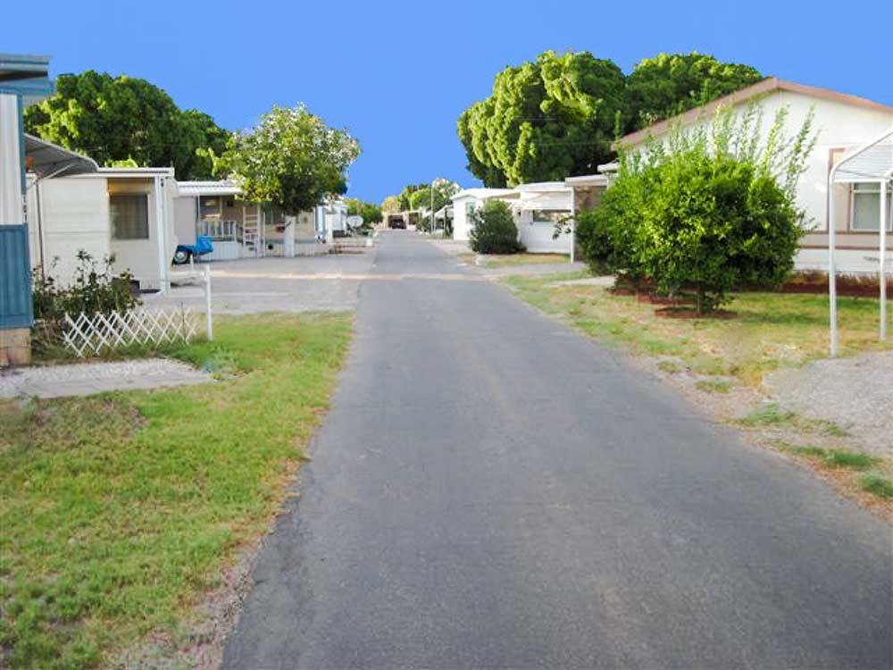 A road between manufactured homes at SHADY ACRES MH & RV PARK