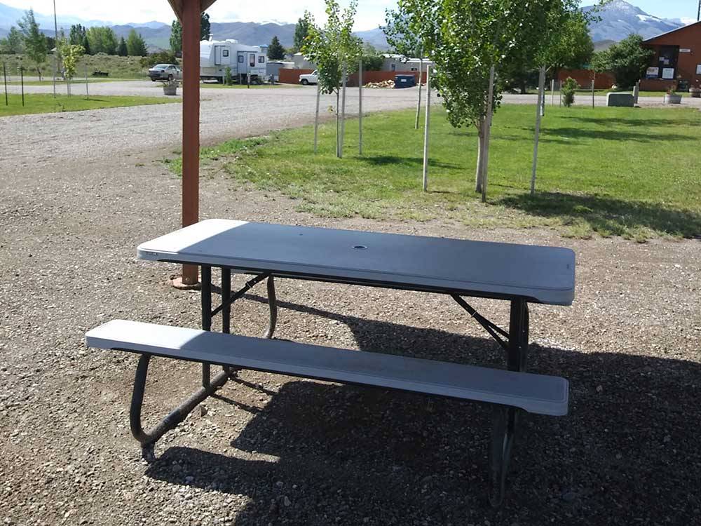 A picnic table under a covered area at ROUND VALLEY PARK