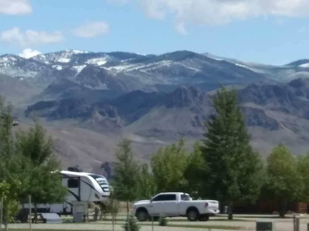 RVs parked near a mountain backdrop at ROUND VALLEY PARK