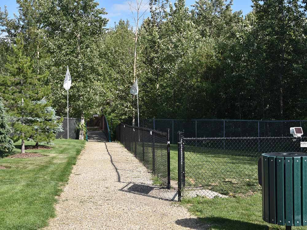 A walkway by the pet area at CAMP 'N CLASS RV PARK