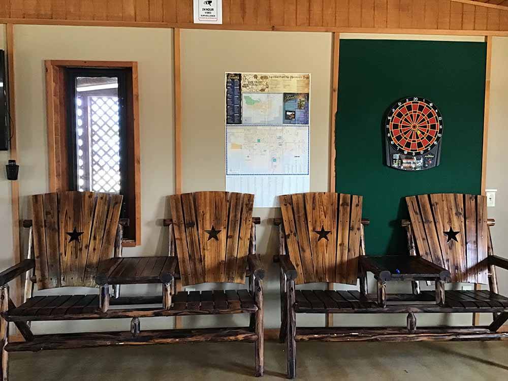 Indoor seating area with dart board at BUFFALO BOB'S RV PARK