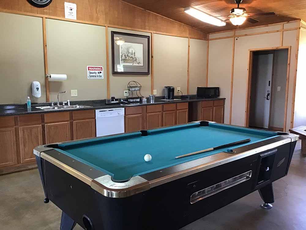 A pool table in the kitchen area at BUFFALO BOB'S RV PARK