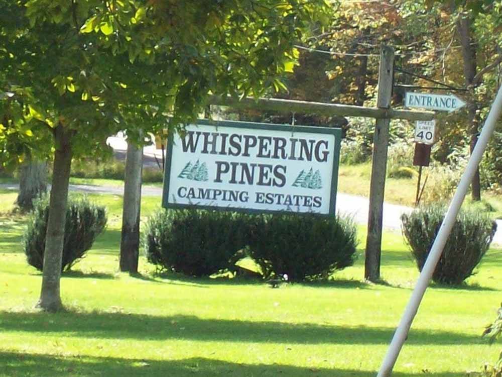 The front entrance sign at WHISPERING PINES CAMPING ESTATES