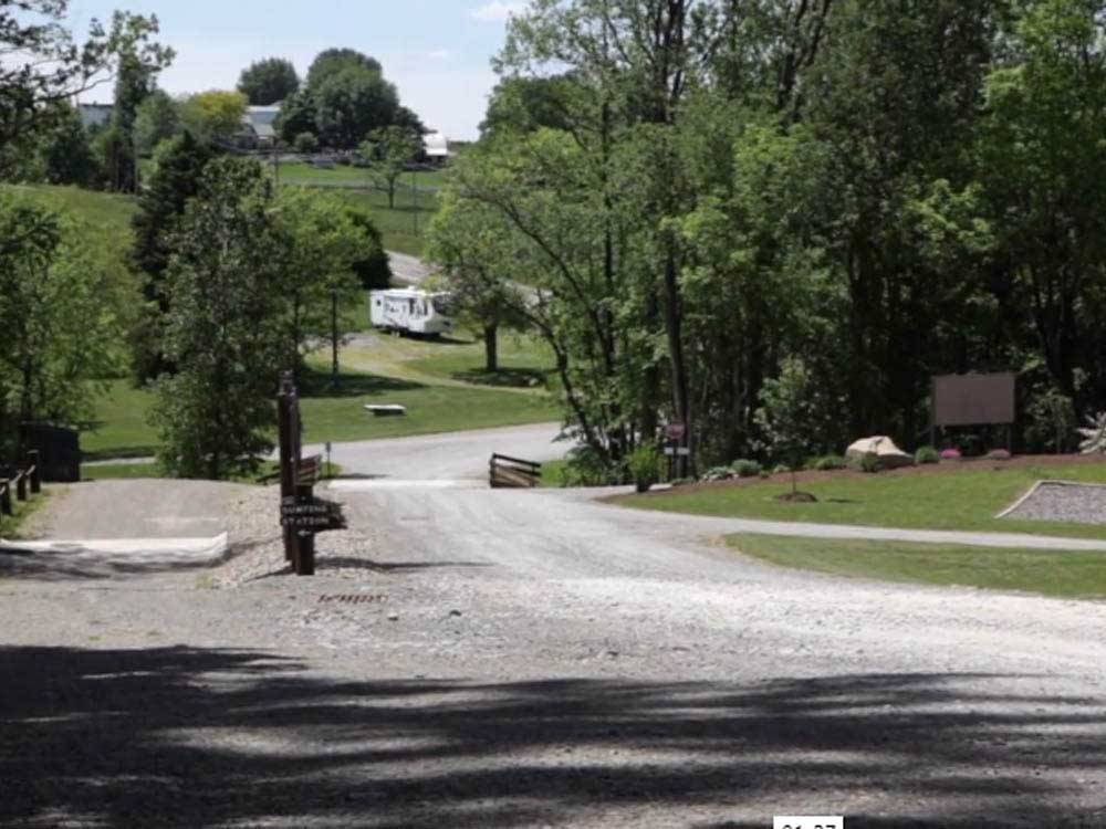 A gravel road leading to the campsites at BERLIN RV PARK & CAMPGROUND