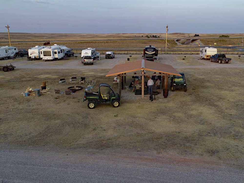 An aerial view of people under a pavilion at EL RANCHO VILLAGE RV & CABINS