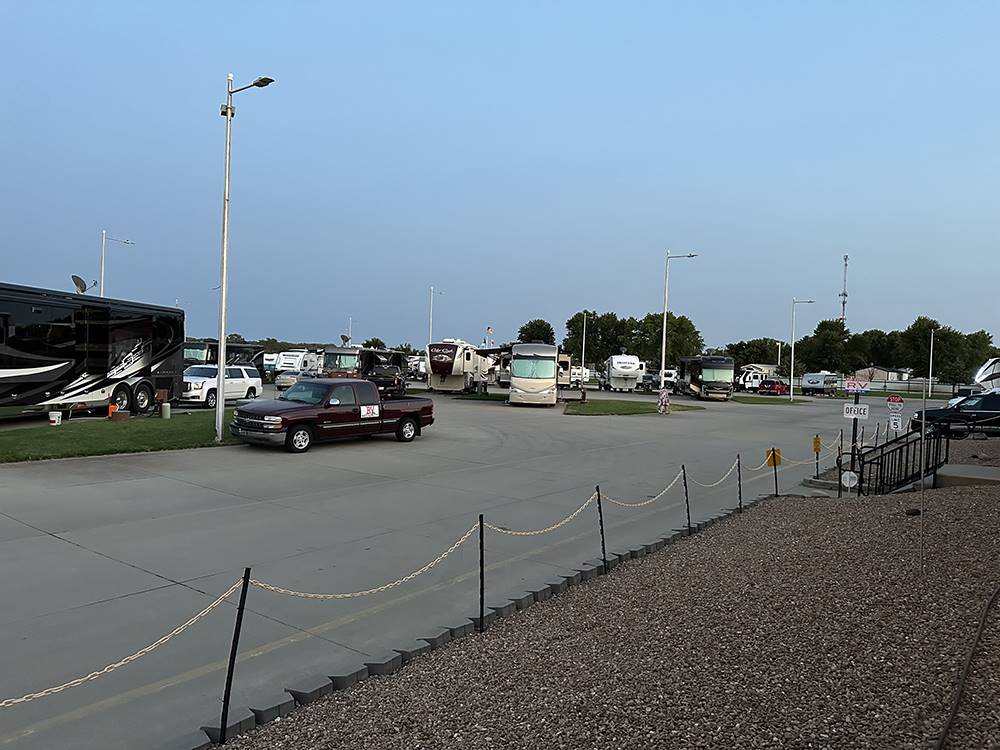 Vehicles and RVs parked at paved sites at Air Capital RV Park