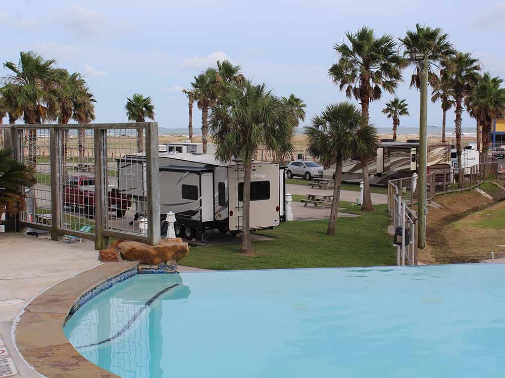 RV sites by the swimming pool at SANDPIPER RV RESORT