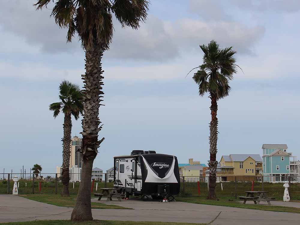 A row of back in RV sites at SANDPIPER RV RESORT