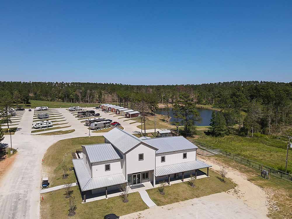 An aerial view of the main building and RV sites at BLUE SKY LAKE LIVINGSTON RV PARK & CABINS