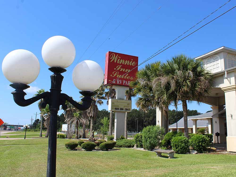 A light post in front of the suites at WINNIE INN  RV PARK
