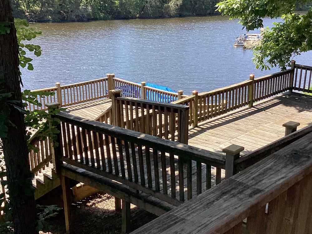 Deck and steps with views of the lake at LONG LAKE RESORT & RV PARK