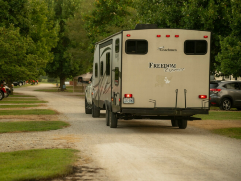 RV driving thru the campground