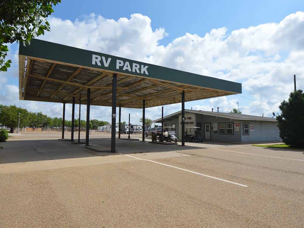 RV park overhang with golf carts at TWIN PINE RV PARK