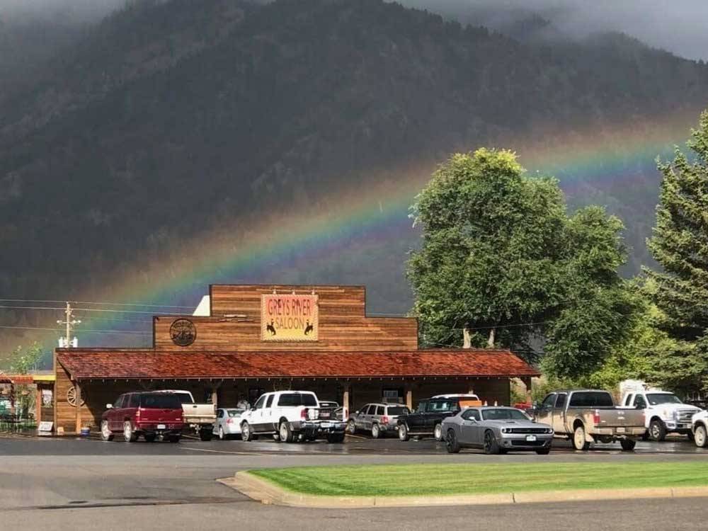 A rainbow behind the saloon at GREYS RIVER COVE RESORT