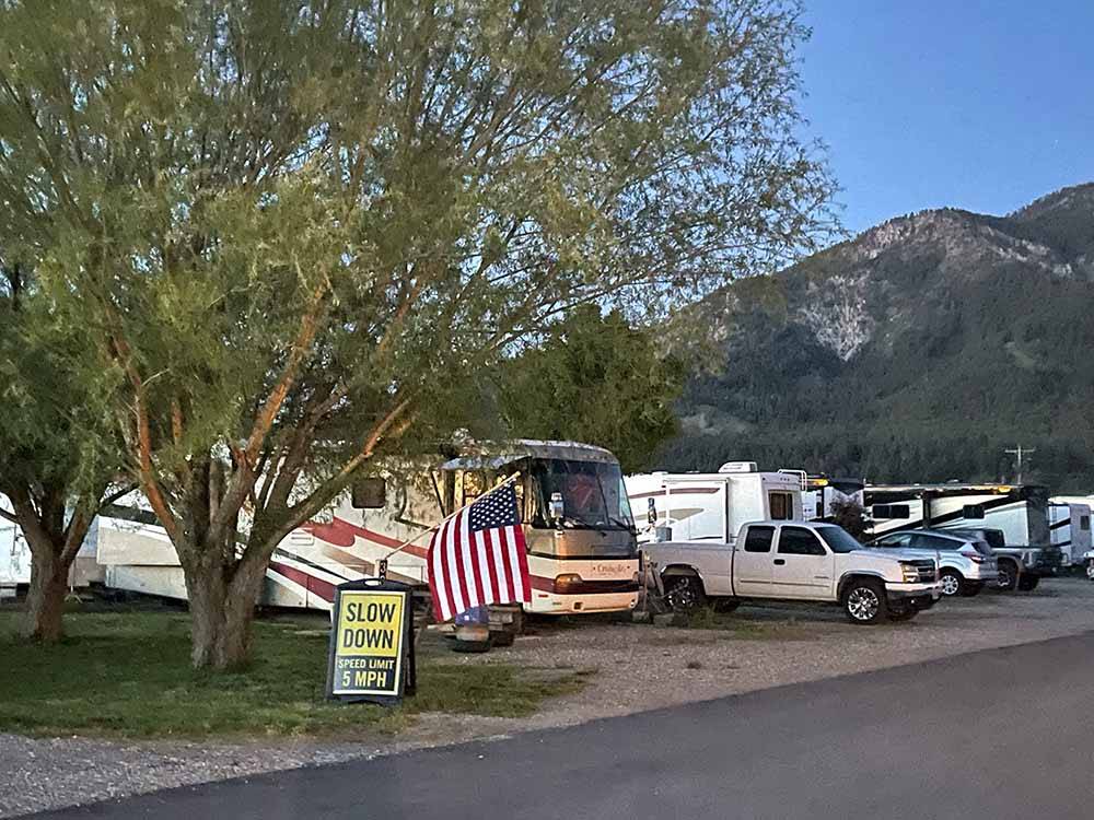 A row of gravel RV sites at GREYS RIVER COVE RESORT