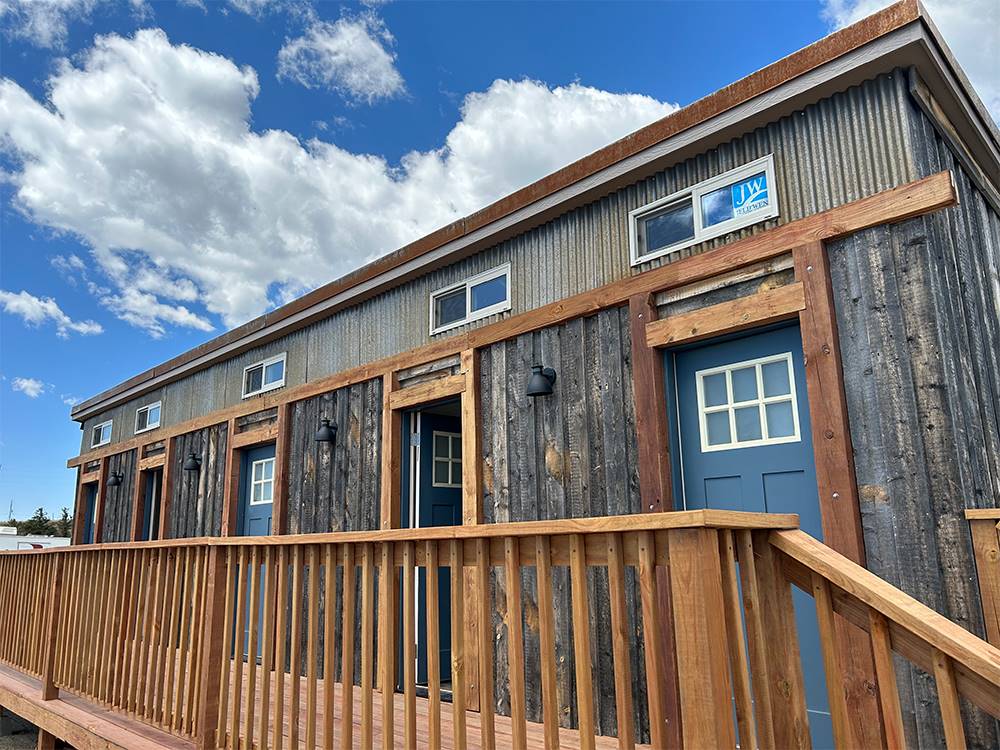 Wooden building with wooden deck at Middlefork RV Resort