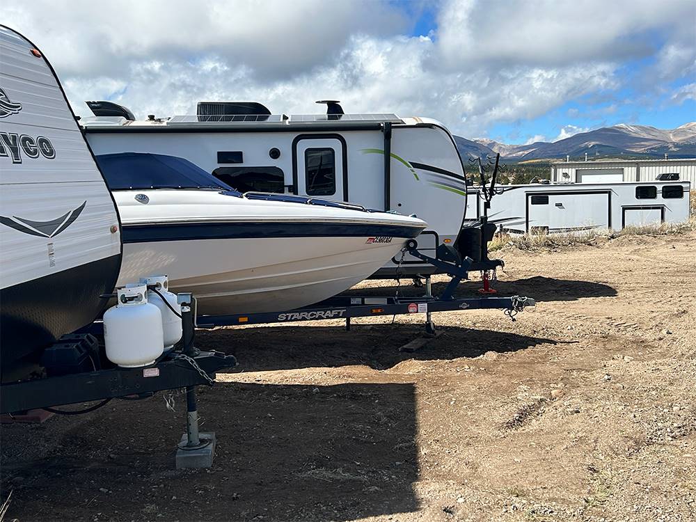 Boat parked between RVs at Middlefork RV Resort