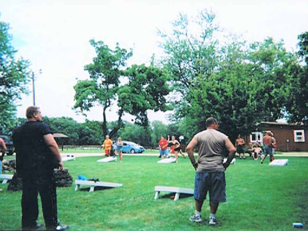 People playing corn hole at HANSEN'S HIDEAWAY RANCH & FAMILY CAMPGROUND