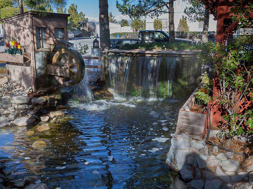 Small waterfall and mill feature at PREFERRED RV RESORT