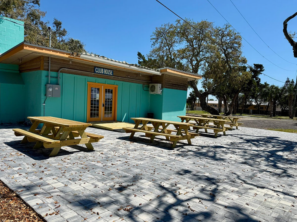 Club house with picnic tables outside