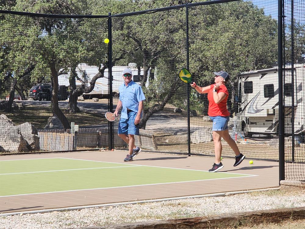 People playing pickleball at LAKE MEDINA RV RESORT