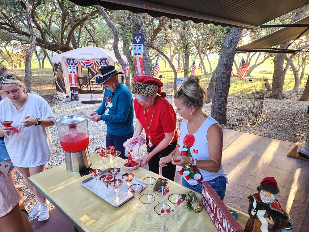 Group of people making desserts at LAKE MEDINA RV RESORT