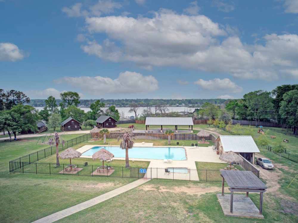 View of pool area and pavilions at WATER'S EDGE RV RESORT
