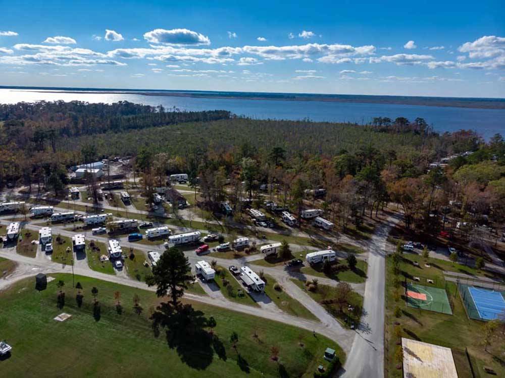 Aerial view of RVs with majestic view in background at NORTH LANDING BEACH RV RESORT  COTTAGES