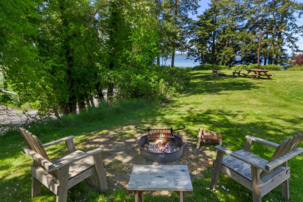 Fire pit with seating area at site West Beach Resort