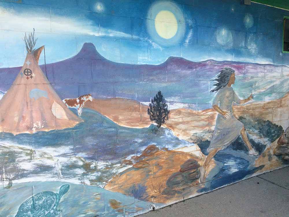 Painted mural on the wall at GREEN TREE'S CRAZY WOMAN CAMPGROUND
