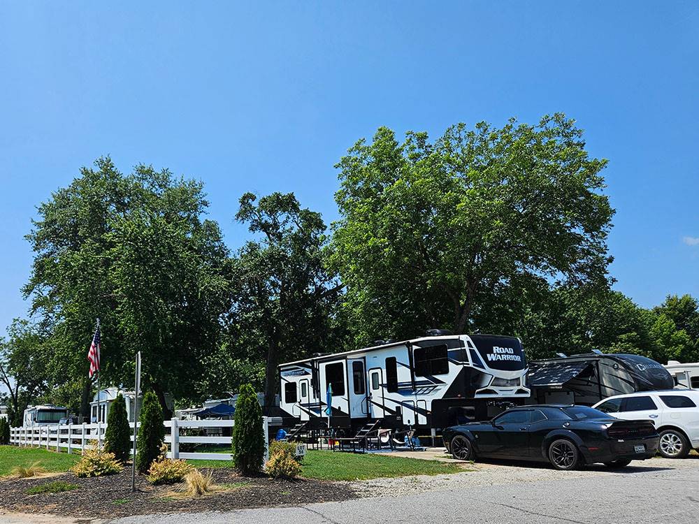 A row of parked RVs at Springwood RV Park