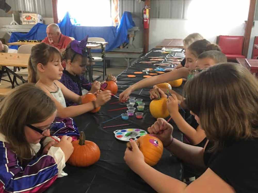 Kids painting pumpkins at WOODLAND PARK